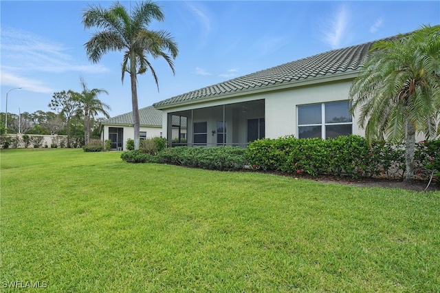 878 Vistana Cir Unit 50, Naples, FL 34119 - view of green lawn with a sunroom