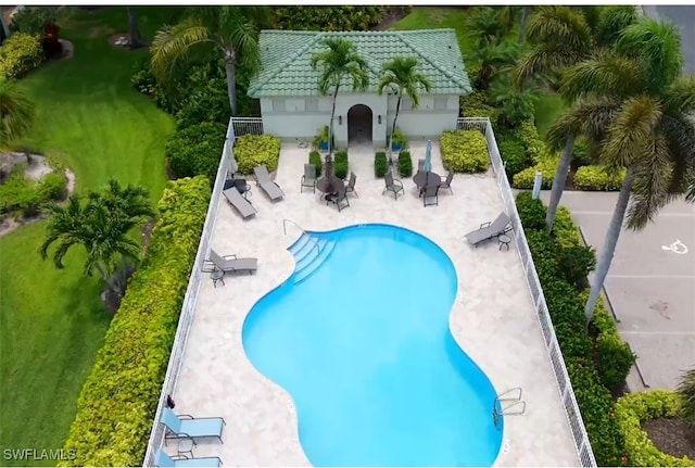 878 Vistana Cir Unit 50, Naples, FL 34119 - community pool featuring a patio area and an outdoor structure