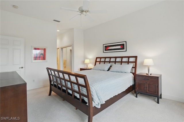 878 Vistana Cir Unit 50, Naples, FL 34119 - bedroom with light carpet, baseboards, and ceiling fan