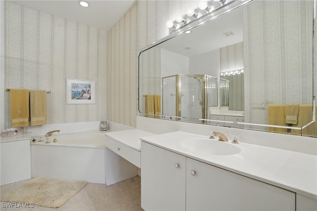 878 Vistana Cir Unit 50, Naples, FL 34119 - bathroom featuring wallpapered walls, vanity, tile patterned floors, a bath, and a stall shower