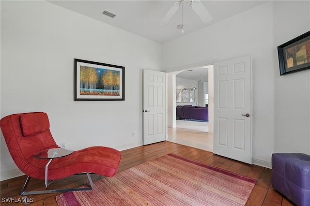 878 Vistana Cir Unit 50, Naples, FL 34119 - sitting room with ceiling fan, hardwood / wood-style floors, and baseboards