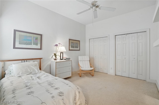 878 Vistana Cir Unit 50, Naples, FL 34119 - bedroom featuring carpet, two closets, baseboards, and ceiling fan