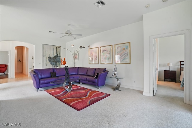 878 Vistana Cir Unit 50, Naples, FL 34119 - living area featuring carpet, arched walkways, a ceiling fan, and baseboards