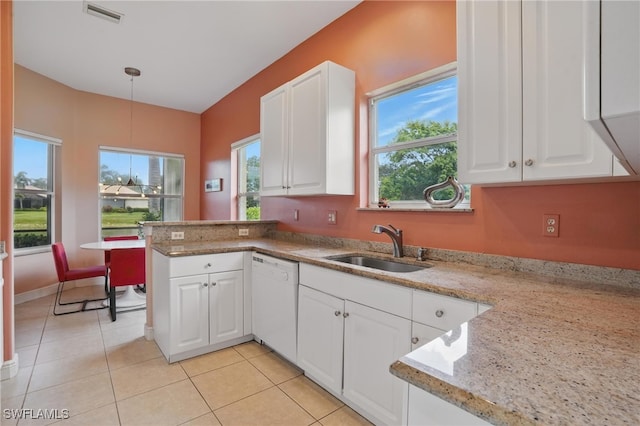 878 Vistana Cir Unit 50, Naples, FL 34119 - kitchen featuring white dishwasher, a sink, white cabinets, and hanging light fixtures