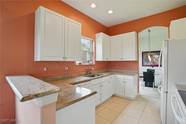 878 Vistana Cir Unit 50, Naples, FL 34119 - kitchen featuring a sink, electric stove, a peninsula, white cabinetry, and recessed lighting
