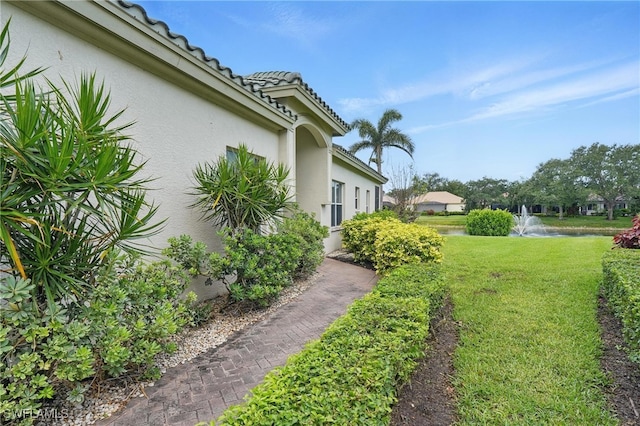 878 Vistana Cir Unit 50, Naples, FL 34119 - view of green lawn with a water view