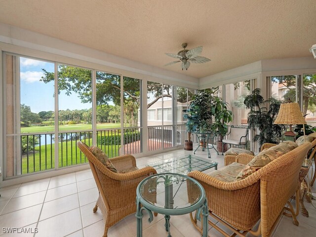 8440 Abbington Cir Unit D16, Naples, FL 34108 - sunroom featuring ceiling fan, a water view, a textured ceiling, and healthy amount of natural light