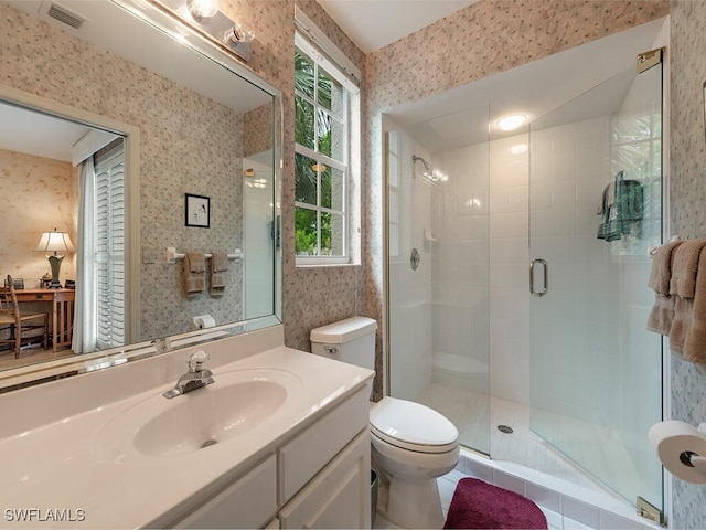 8440 Abbington Cir Unit D16, Naples, FL 34108 - full bath with wallpapered walls, a shower stall, vanity, toilet, and healthy amount of natural light