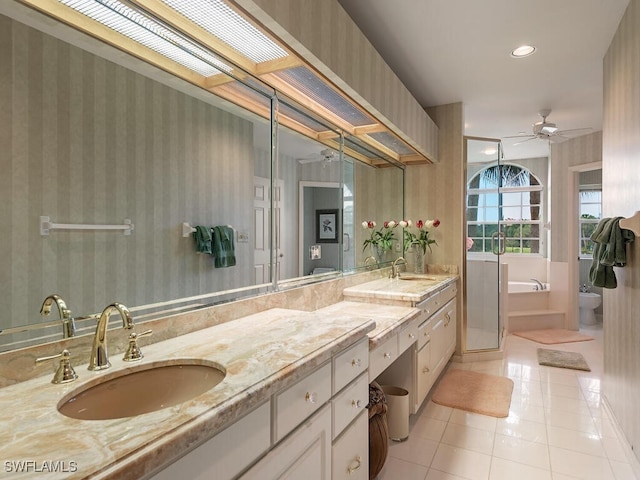 8440 Abbington Cir Unit D16, Naples, FL 34108 - bathroom featuring double vanity, ceiling fan, tile patterned flooring, a bath, and recessed lighting