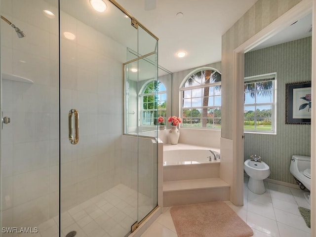 8440 Abbington Cir Unit D16, Naples, FL 34108 - bathroom featuring wallpapered walls, a bidet, a bath, a stall shower, and tile patterned floors