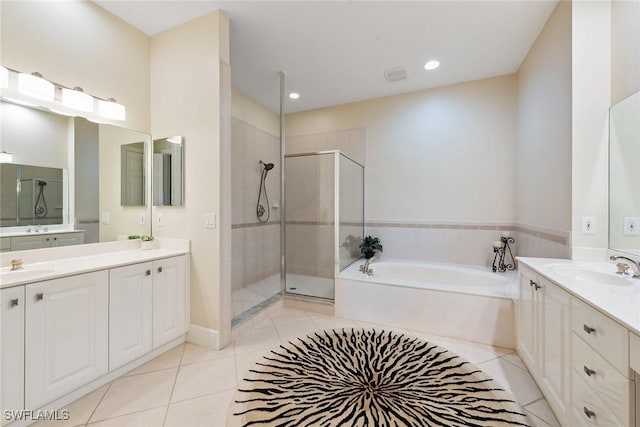 9022 Cascada Way Unit 201, Naples, FL 34114 - full bathroom featuring a bath, a shower stall, two vanities, tile patterned floors, and recessed lighting