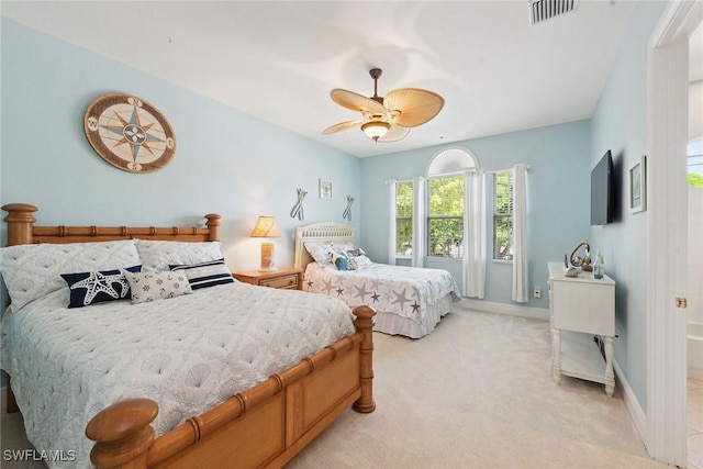 9022 Cascada Way Unit 201, Naples, FL 34114 - bedroom with light colored carpet, baseboards, and ceiling fan
