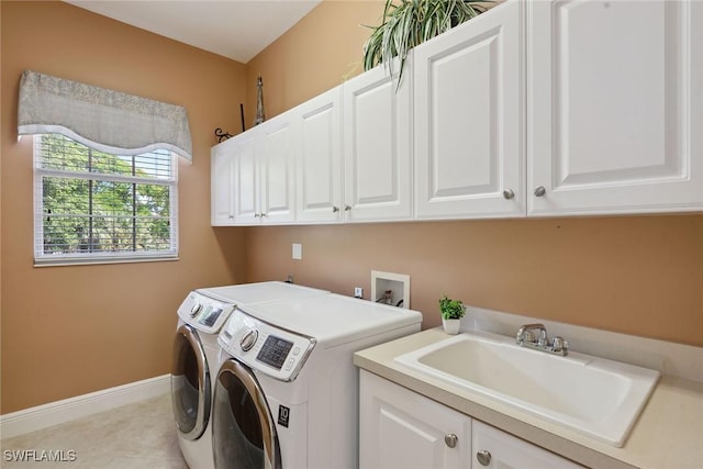 9022 Cascada Way Unit 201, Naples, FL 34114 - laundry room with cabinet space, separate washer and dryer, baseboards, and light tile patterned floors