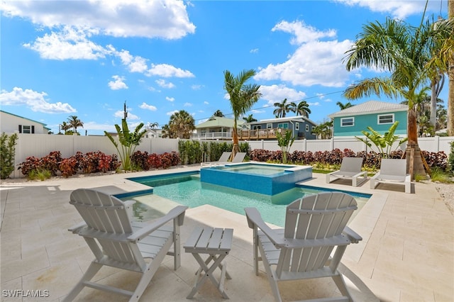 5583 Estero Blvd, Fort Myers Beach, FL 33931 - view of pool featuring a patio, a fenced backyard, and a pool with connected hot tub