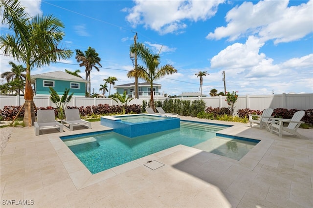 5583 Estero Blvd, Fort Myers Beach, FL 33931 - view of swimming pool featuring a patio area, a fenced backyard, and a pool with connected hot tub