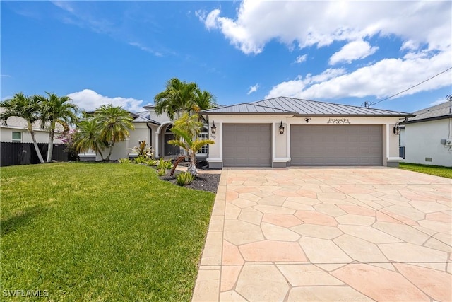3628 NW 3rd Ter, Cape Coral, FL 33993 - view of front of home featuring a standing seam roof, stucco siding, a garage, concrete driveway, and metal roof