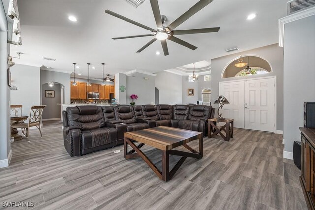 3628 NW 3rd Ter, Cape Coral, FL 33993 - living room with ceiling fan, baseboards, recessed lighting, crown molding, and light wood-style floors