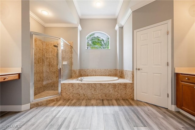 3628 NW 3rd Ter, Cape Coral, FL 33993 - full bathroom featuring vanity, a garden tub, a stall shower, wood finished floors, and crown molding
