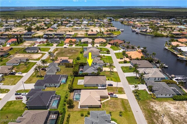 3628 NW 3rd Ter, Cape Coral, FL 33993 - aerial perspective of suburban area featuring a large body of water