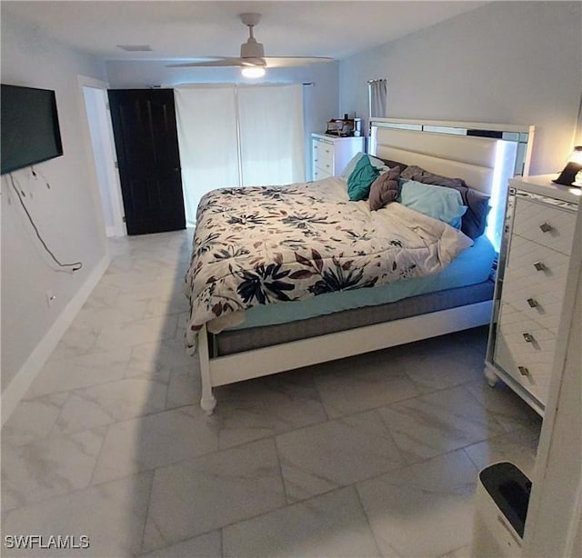 306 Pendleton Ave, Lehigh Acres, FL 33974 - bedroom featuring light marble finish flooring, baseboards, and a ceiling fan