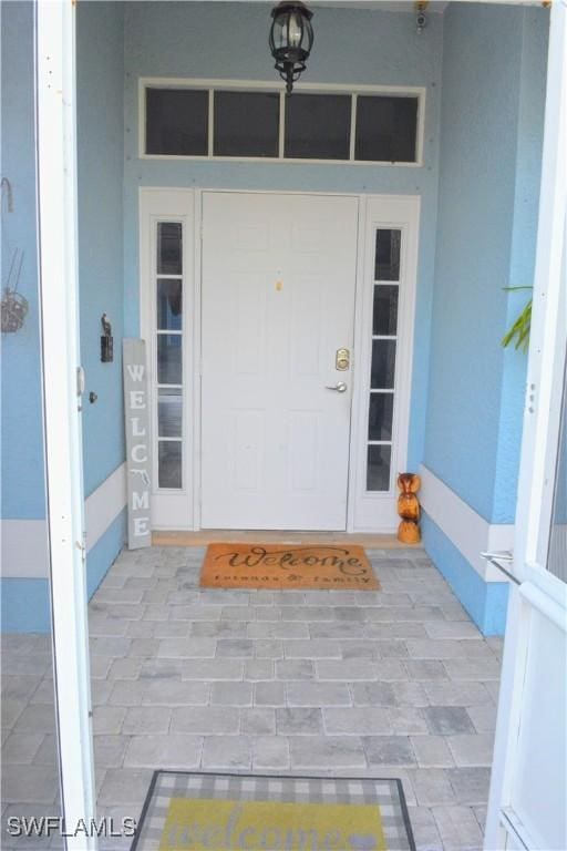 306 Pendleton Ave, Lehigh Acres, FL 33974 - entrance to property with stucco siding