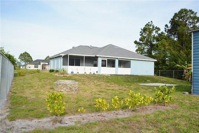 306 Pendleton Ave, Lehigh Acres, FL 33974 - back of property featuring a sunroom