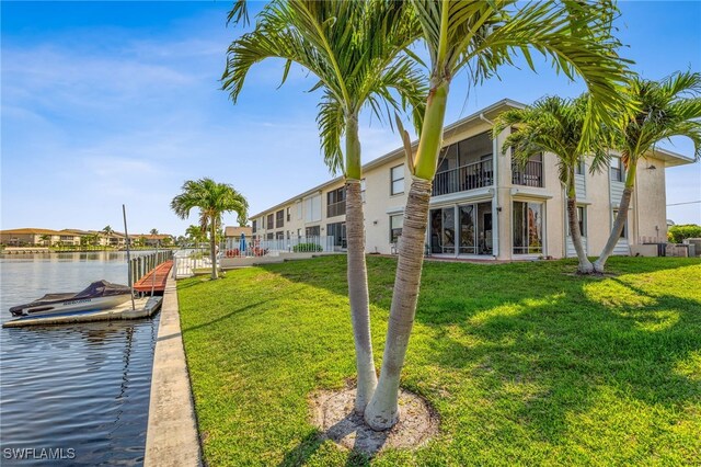 4538 SE 5th Pl Unit 3, Cape Coral, FL 33904 - dock area with a yard and a water view