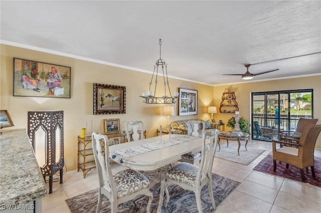 4538 SE 5th Pl Unit 3, Cape Coral, FL 33904 - dining space with light tile patterned flooring, crown molding, ceiling fan, and baseboards