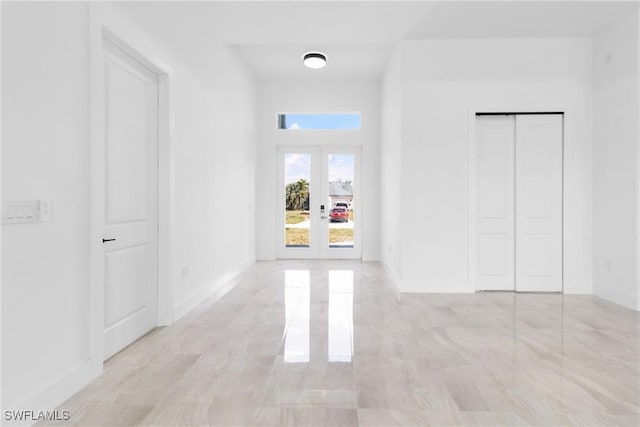 1503 NW 8th Pl, Cape Coral, FL 33993 - corridor featuring french doors and baseboards