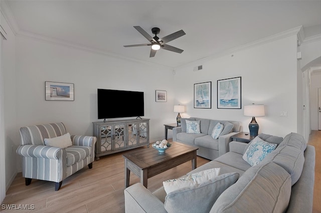 10275 Heritage Bay Blvd Unit 737, Naples, FL 34120 - living area with light wood-style floors, ceiling fan, crown molding, and arched walkways