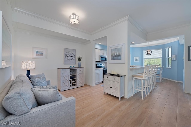 10275 Heritage Bay Blvd Unit 737, Naples, FL 34120 - living area with crown molding, light wood-style floors, and baseboards