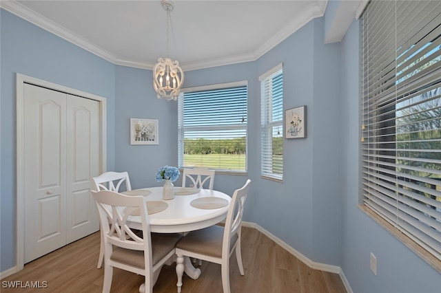 10275 Heritage Bay Blvd Unit 737, Naples, FL 34120 - dining space featuring light wood-type flooring, a chandelier, ornamental molding, and baseboards