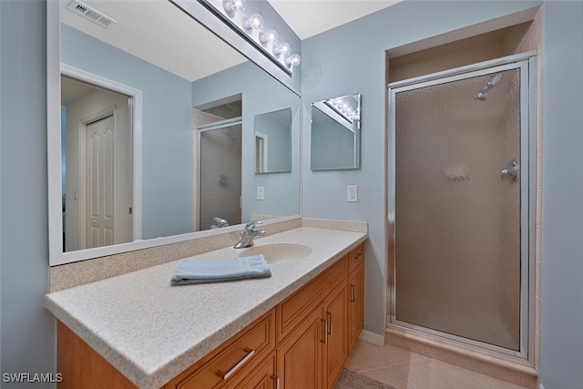 10275 Heritage Bay Blvd Unit 737, Naples, FL 34120 - full bathroom featuring vanity, a shower stall, tile patterned floors, and baseboards