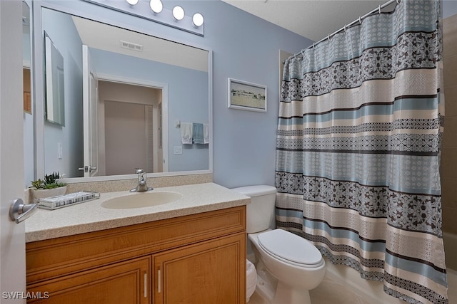 10275 Heritage Bay Blvd Unit 737, Naples, FL 34120 - bathroom with toilet, vanity, and curtained shower