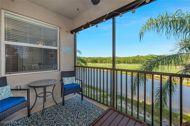 10275 Heritage Bay Blvd Unit 737, Naples, FL 34120 - balcony featuring a water view, a ceiling fan, and view of scattered trees