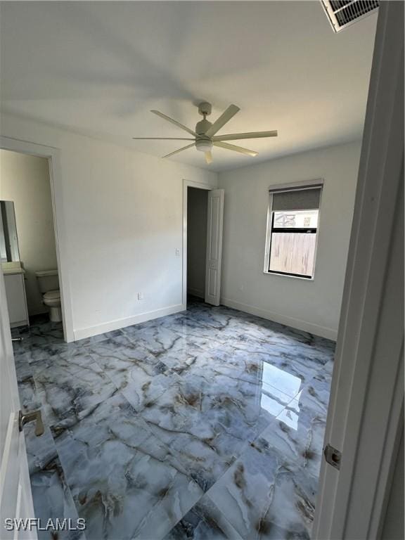 363 SW 24th Ct, Cape Coral, FL 33991 - unfurnished bedroom with marble finish floors, ceiling fan, ensuite bathroom, and baseboards