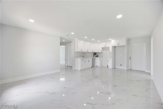 2511 45th St W, Lehigh Acres, FL 33971 - unfurnished living room featuring baseboards, a sink, recessed lighting, and light marble finish floors