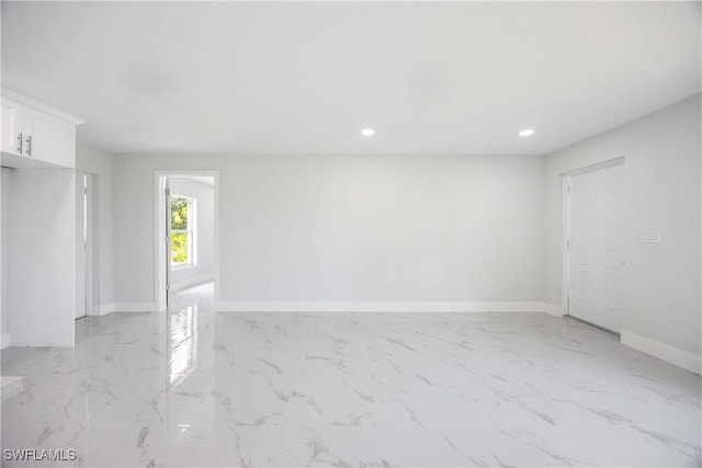 2511 45th St W, Lehigh Acres, FL 33971 - empty room featuring light marble finish flooring, baseboards, and recessed lighting