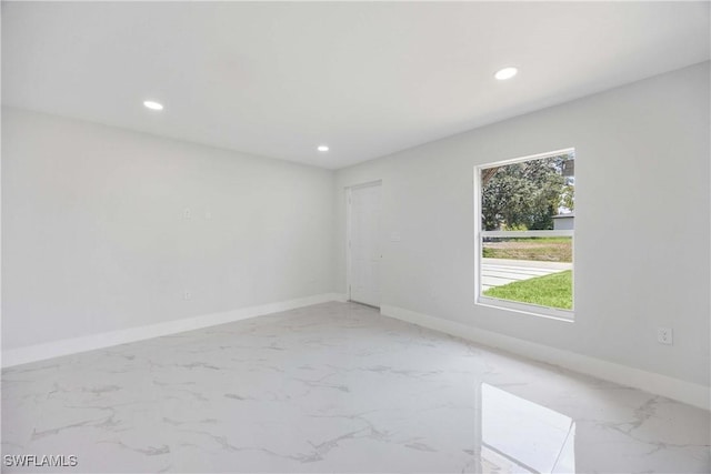 2511 45th St W, Lehigh Acres, FL 33971 - spare room with light marble finish floors, recessed lighting, and baseboards
