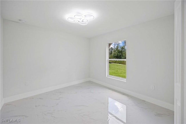 2511 45th St W, Lehigh Acres, FL 33971 - unfurnished room with baseboards and marble look tiles