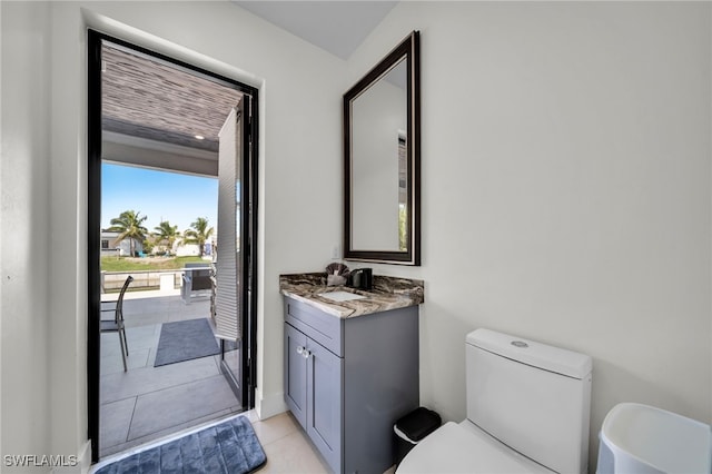 2405 SW 11th Ave, Cape Coral, FL 33991 - bathroom with toilet, vanity, and tile patterned flooring