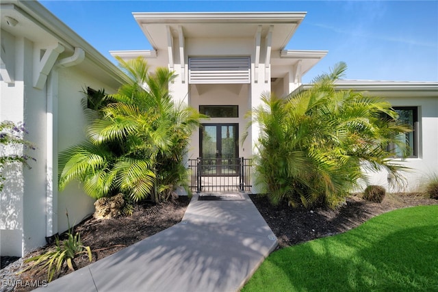 2405 SW 11th Ave, Cape Coral, FL 33991 - doorway to property featuring french doors, a gate, and stucco siding