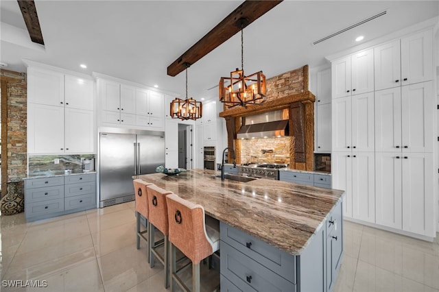 2405 SW 11th Ave, Cape Coral, FL 33991 - kitchen featuring built in refrigerator, a sink, gray cabinets, recessed lighting, and beam ceiling