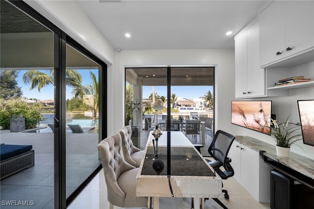 2405 SW 11th Ave, Cape Coral, FL 33991 - dining area with light tile patterned floors and recessed lighting