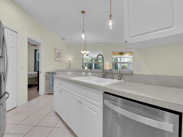 2040 Embarcadero Way N, Fort Myers, FL 33917 - kitchen featuring dishwasher, a sink, light countertops, and light tile patterned floors