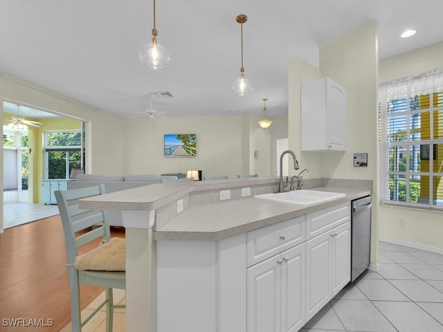 2040 Embarcadero Way N, Fort Myers, FL 33917 - kitchen with a sink, stainless steel dishwasher, light countertops, and a ceiling fan