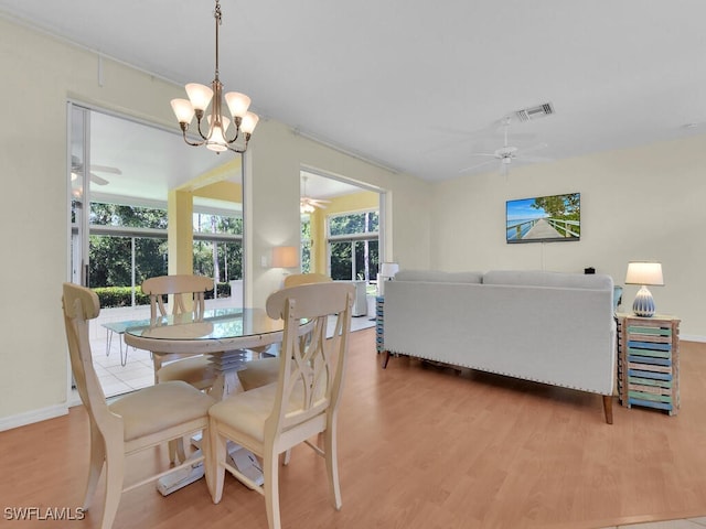 2040 Embarcadero Way N, Fort Myers, FL 33917 - dining area featuring ceiling fan, wood finished floors, a chandelier, and baseboards