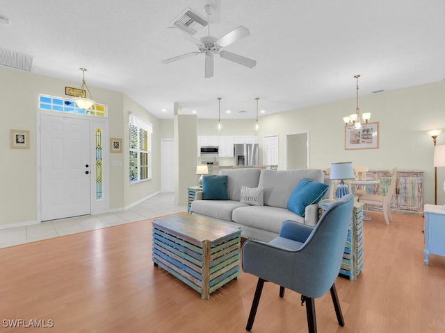 2040 Embarcadero Way N, Fort Myers, FL 33917 - living area featuring light wood-style floors, a chandelier, baseboards, ceiling fan, and recessed lighting