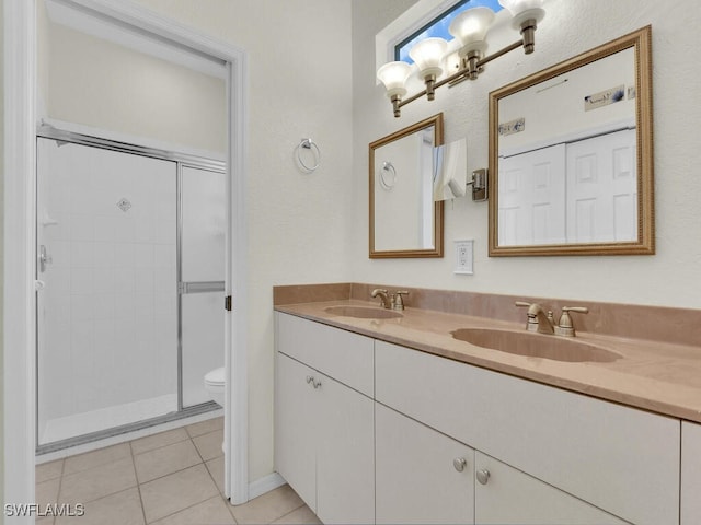 2040 Embarcadero Way N, Fort Myers, FL 33917 - full bathroom featuring double vanity, toilet, a stall shower, and tile patterned floors