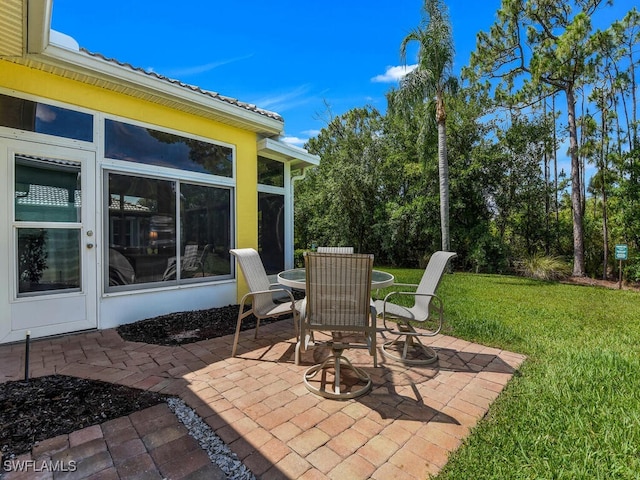 2040 Embarcadero Way N, Fort Myers, FL 33917 - view of patio / terrace with outdoor dining area and a sunroom